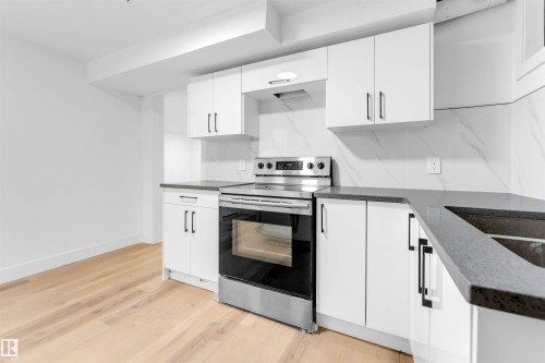 7303 130 Avenue, Edmonton, AB - Indoor Photo Showing Kitchen With Double Sink With Upgraded Kitchen