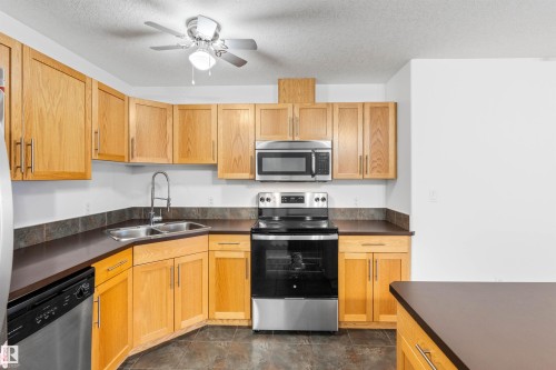 226 300 Spruce Ridge Road, Spruce Grove, AB - Indoor Photo Showing Kitchen With Stainless Steel Kitchen With Double Sink