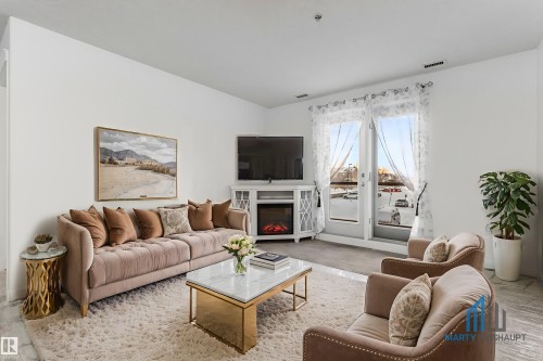 226 300 Spruce Ridge Road, Spruce Grove, AB - Indoor Photo Showing Living Room With Fireplace