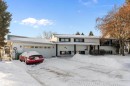 View of front facade featuring a garage and a porch - 145 Plum Crescent, Wetaskiwin, AB  - Outdoor With Facade 
