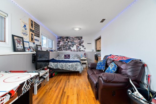 Bedroom featuring light wood-type flooring - 145 Plum Crescent, Wetaskiwin, AB - Indoor