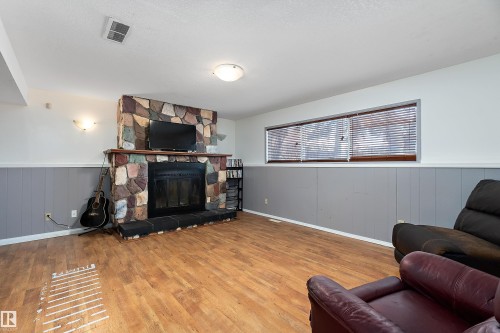 145 Plum Crescent, Wetaskiwin, AB - Indoor Photo Showing Living Room With Fireplace