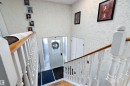 Foyer featuring a textured wall and stairs - 145 Plum Crescent, Wetaskiwin, AB  - Indoor Photo Showing Other Room 