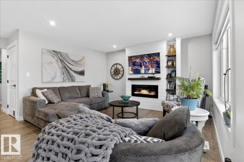 592 Meadowview Drive, Fort Saskatchewan, AB - Indoor Photo Showing Living Room With Fireplace