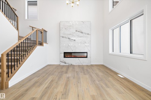 4 Axelwood Crescent, Spruce Grove, AB - Indoor Photo Showing Other Room With Fireplace