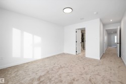 Unfurnished bedroom featuring light colored carpet and recessed lighting - 