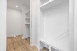 Spacious closet featuring light wood-type flooring - 