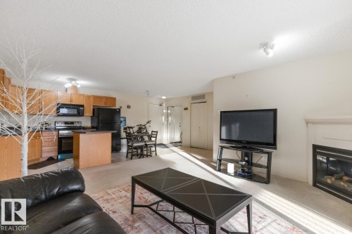 430 16311 95 Street, Edmonton, AB - Indoor Photo Showing Living Room With Fireplace
