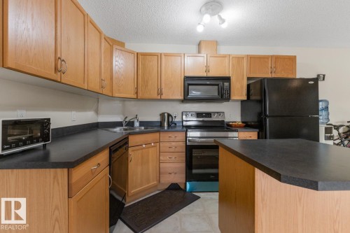430 16311 95 Street, Edmonton, AB - Indoor Photo Showing Kitchen With Double Sink