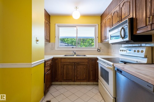 6411 149 Avenue, Edmonton, AB - Indoor Photo Showing Kitchen With Double Sink