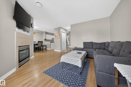 80 2505 42 Street, Edmonton, AB - Indoor Photo Showing Living Room With Fireplace