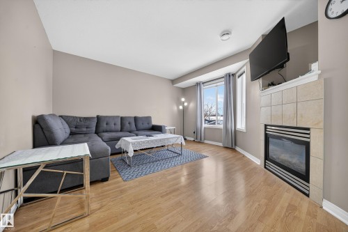 80 2505 42 Street, Edmonton, AB - Indoor Photo Showing Living Room With Fireplace