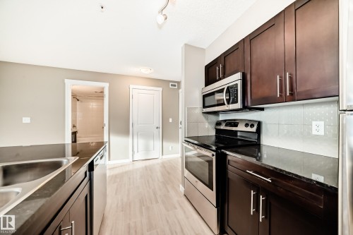 226 1510 Watt Drive, Edmonton, AB - Indoor Photo Showing Kitchen With Stainless Steel Kitchen With Double Sink With Upgraded Kitchen