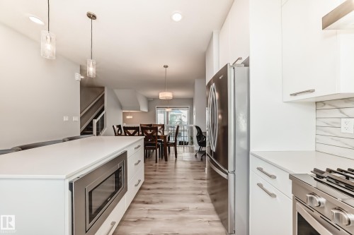 69 50 Ebony Boulevard, Sherwood Park, AB - Indoor Photo Showing Kitchen With Stainless Steel Kitchen With Upgraded Kitchen
