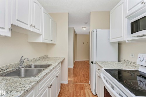 1711 10883 Saskatchewan Drive, Edmonton, AB - Indoor Photo Showing Kitchen With Double Sink