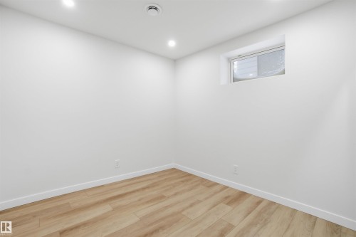 Spare room with light wood-style floors and recessed lighting - 5711 95 Avenue, Edmonton, AB - Indoor Photo Showing Other Room