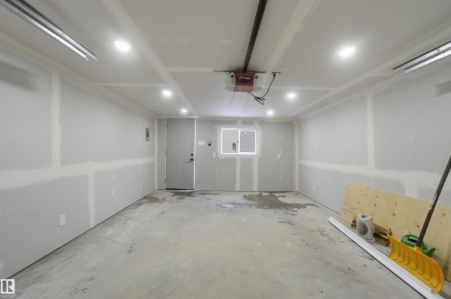 Garage featuring a garage door opener - 5711 95 Avenue, Edmonton, AB - Indoor