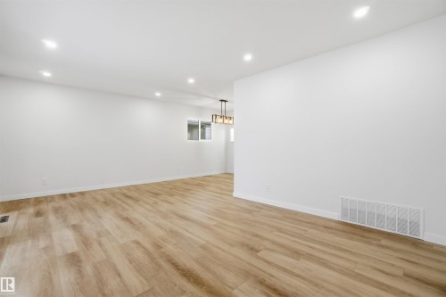 Empty room with recessed lighting and light wood-style floors - 5711 95 Avenue, Edmonton, AB - Indoor Photo Showing Other Room