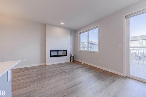 1745 Plum Crescent Sw, Edmonton, AB - Indoor Photo Showing Living Room With Fireplace