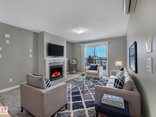 407 592 Hooke Road, Edmonton, AB - Indoor Photo Showing Living Room With Fireplace