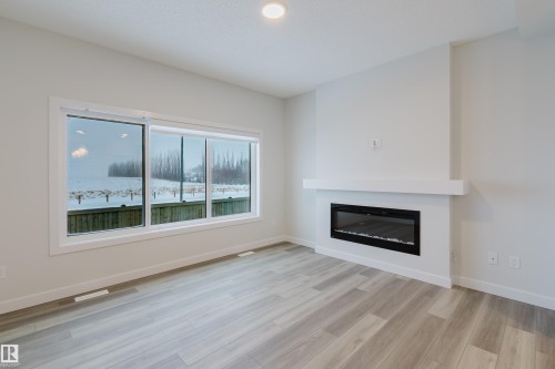 4118 67 Street, Beaumont, AB - Indoor Photo Showing Living Room With Fireplace