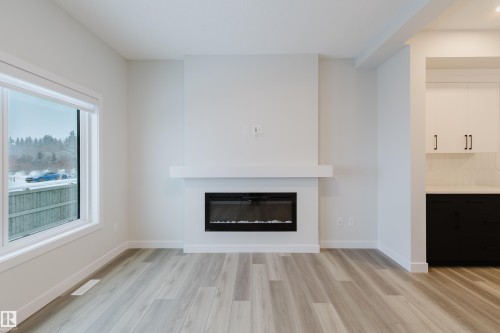 4118 67 Street, Beaumont, AB - Indoor Photo Showing Living Room With Fireplace