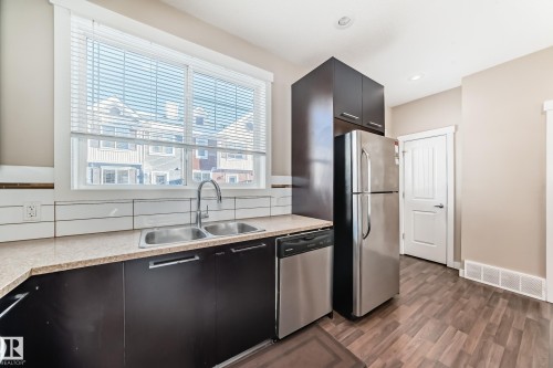 65 8315 180 Avenue, Edmonton, AB - Indoor Photo Showing Kitchen With Stainless Steel Kitchen With Double Sink