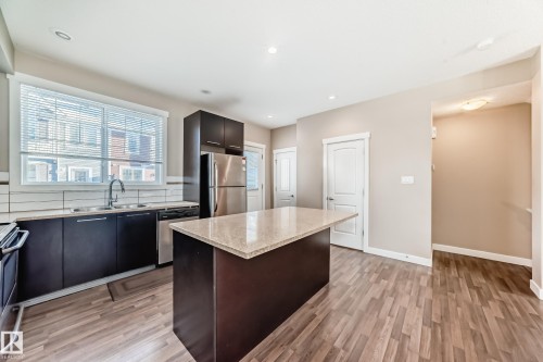 65 8315 180 Avenue, Edmonton, AB - Indoor Photo Showing Kitchen With Stainless Steel Kitchen With Double Sink