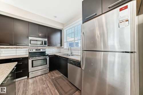 65 8315 180 Avenue, Edmonton, AB - Indoor Photo Showing Kitchen With Stainless Steel Kitchen With Double Sink With Upgraded Kitchen