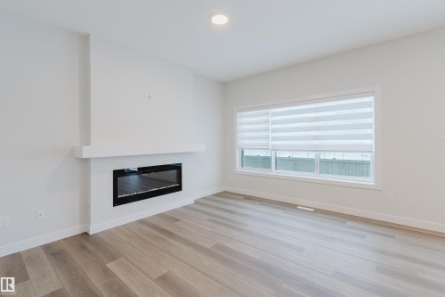 4106 67 Street, Beaumont, AB - Indoor Photo Showing Living Room With Fireplace