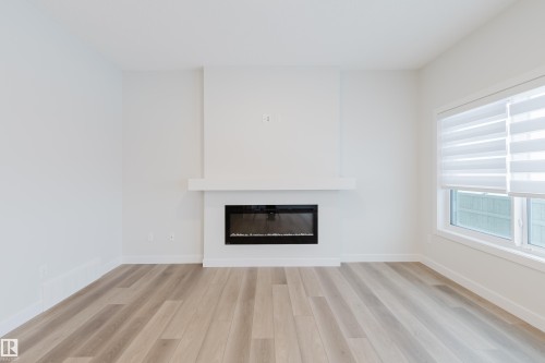 4106 67 Street, Beaumont, AB - Indoor Photo Showing Living Room With Fireplace