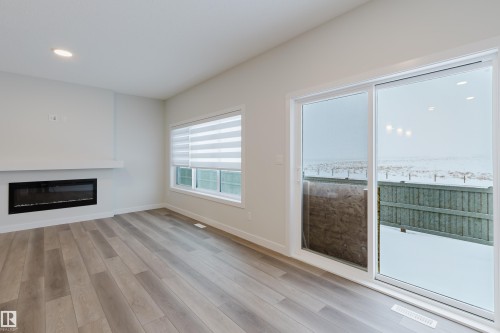 4106 67 Street, Beaumont, AB - Indoor Photo Showing Living Room With Fireplace