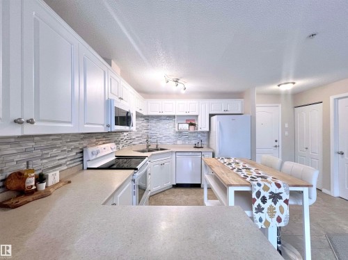 206 111 Edwards Drive, Edmonton, AB - Indoor Photo Showing Kitchen With Double Sink With Upgraded Kitchen