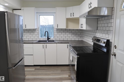 New counters and Back splash - 4508 52 St., Wetaskiwin, AB - Indoor Photo Showing Kitchen With Double Sink