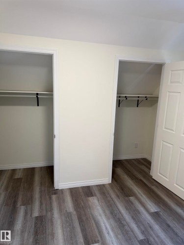His and Hers Closets - 4508 52 St., Wetaskiwin, AB - Indoor Photo Showing Other Room