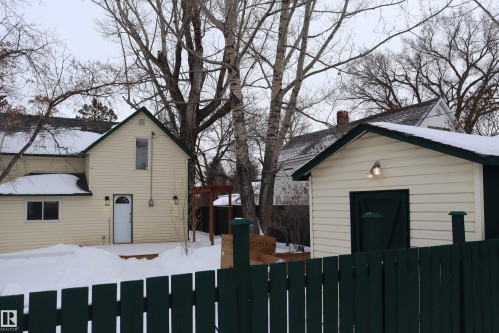 Fenced yard with large storage shed with power. - 4508 52 St., Wetaskiwin, AB - Outdoor With Exterior