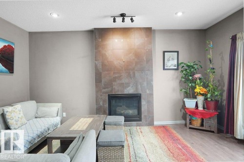 1533 36B Avenue, Edmonton, AB - Indoor Photo Showing Living Room With Fireplace