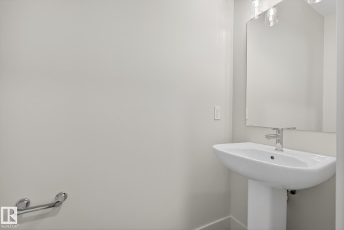 Bathroom featuring baseboards - 119 Brickyard Drive, Stony Plain, AB - Indoor Photo Showing Bathroom