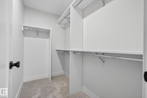 Spacious closet with light carpet - 119 Brickyard Drive, Stony Plain, AB - Indoor With Storage