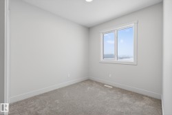 Empty room with carpet and baseboards - 