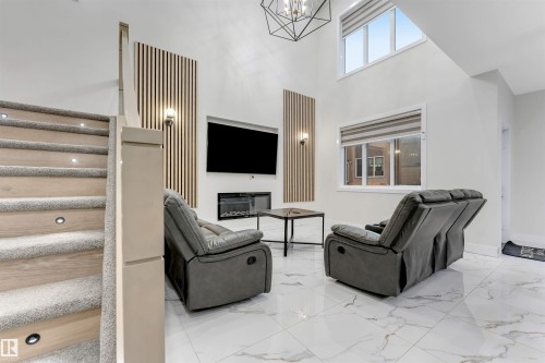 16916 47 Street, Edmonton, AB - Indoor Photo Showing Other Room With Fireplace