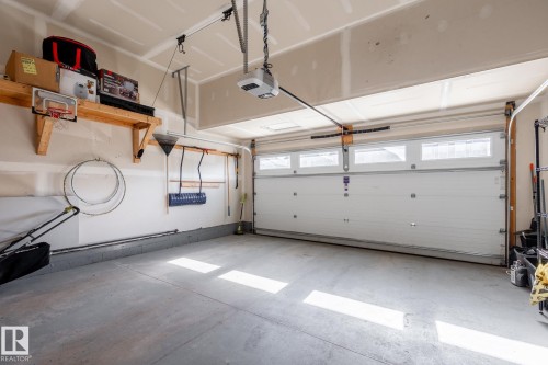 Garage with a garage door opener - 1440 Darby Green, Edmonton, AB - Indoor Photo Showing Garage