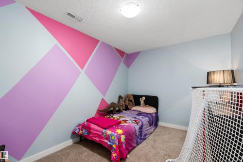 33 Wild Hay Drive, Devon, AB - Indoor Photo Showing Bedroom