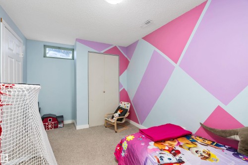 33 Wild Hay Drive, Devon, AB - Indoor Photo Showing Bedroom