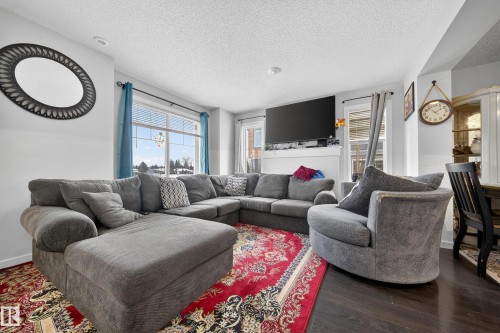 11 3025 151 Avenue, Edmonton, AB - Indoor Photo Showing Living Room With Fireplace