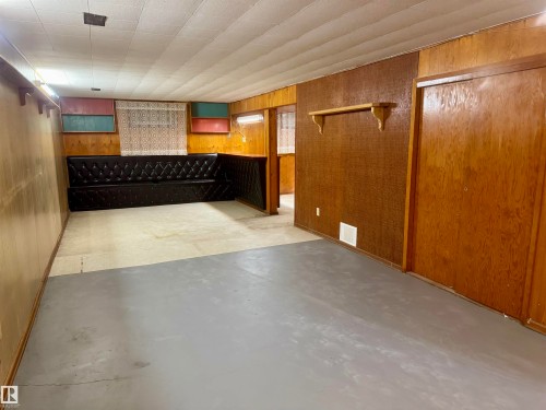 Finished basement with wooden walls - 5140 52 Avenue, Ryley, AB - Indoor Photo Showing Other Room