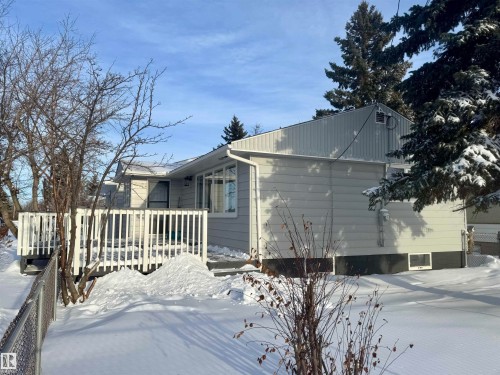 Snow covered property with a deck - 5140 52 Avenue, Ryley, AB - Outdoor