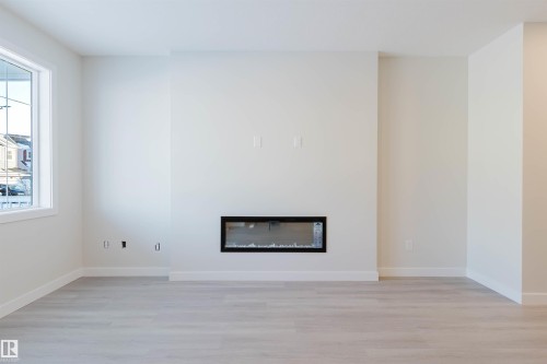 5412 69 Street, Beaumont, AB - Indoor Photo Showing Living Room With Fireplace