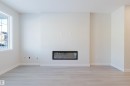 5412 69 Street, Beaumont, AB  - Indoor Photo Showing Living Room With Fireplace 