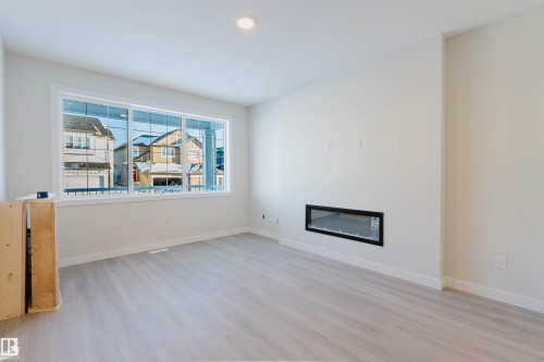 5412 69 Street, Beaumont, AB - Indoor Photo Showing Living Room With Fireplace